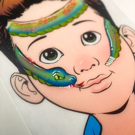 Boy with hand-painted snake and dragon face painting design