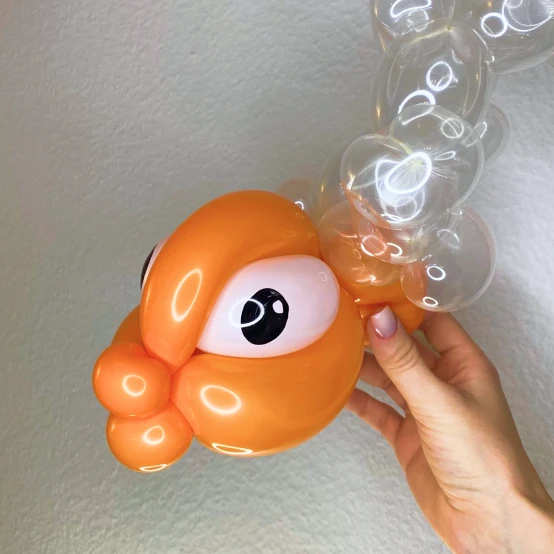 Orange balloon shaped like a fish